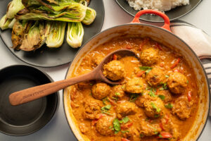 Red curry sauce with chicken meatballs.