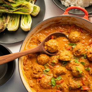 Red curry sauce with chicken meatballs.