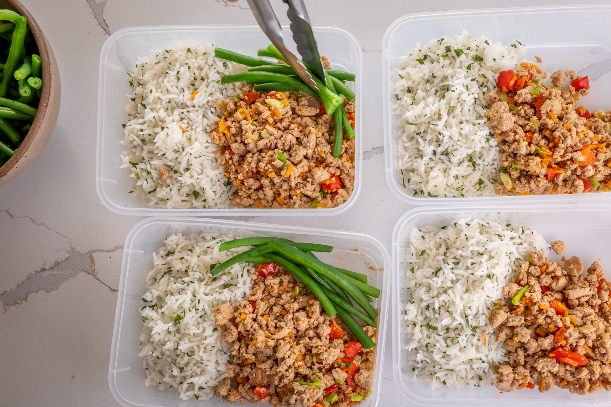 Meal prep, teriyaki seasoned ground chicken with cilantro rice and green beans.