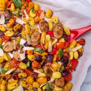 Sheet pan with Isernio's Italian Chicken Sausages, diced and roasted vegetables, and pan roasted gnocchi.